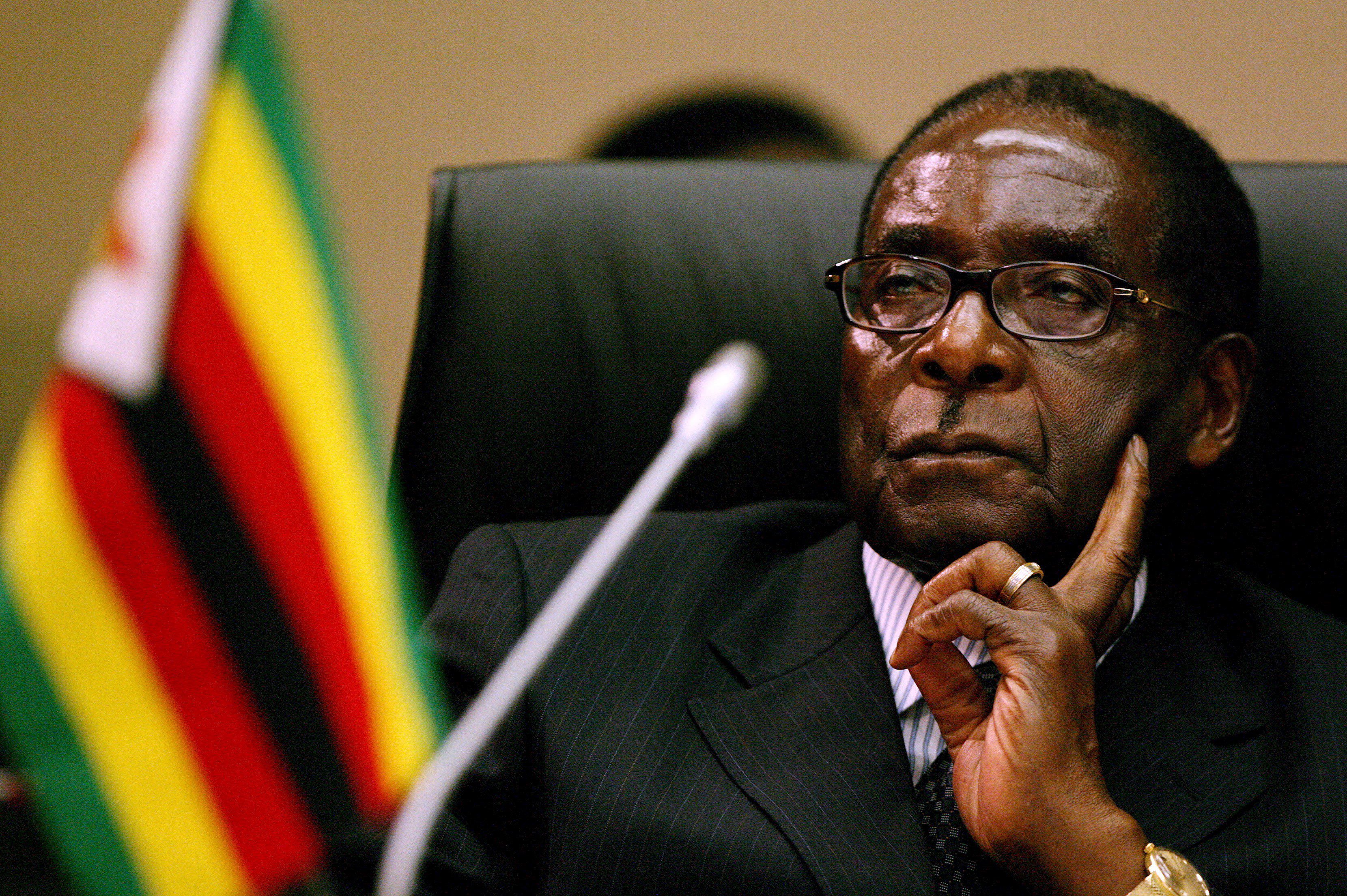 epa01648158 (FILE) A file photograph showing Zimbabwean President Robert Mugabe attending the Southern African Development Community (SADC) Extraordinary Summit of Heads of State and Government at the Sandton Convention Centre in Johannesburg, South Africa, 09 November 2008. President Robert Mugabe said that Zimbabwe could hold fresh elections in two years if a new constitution is approved in a referendum, in an interview with state media on 26 February 2009. Mugabe, said in the Herald newspaper that the new unity government with Prime Minister Morgan Tsvangirai, formed only two weeks ago, was a temporary solution until the parties could agree on a new charter and fresh polls. EPA/JON HRUSA
