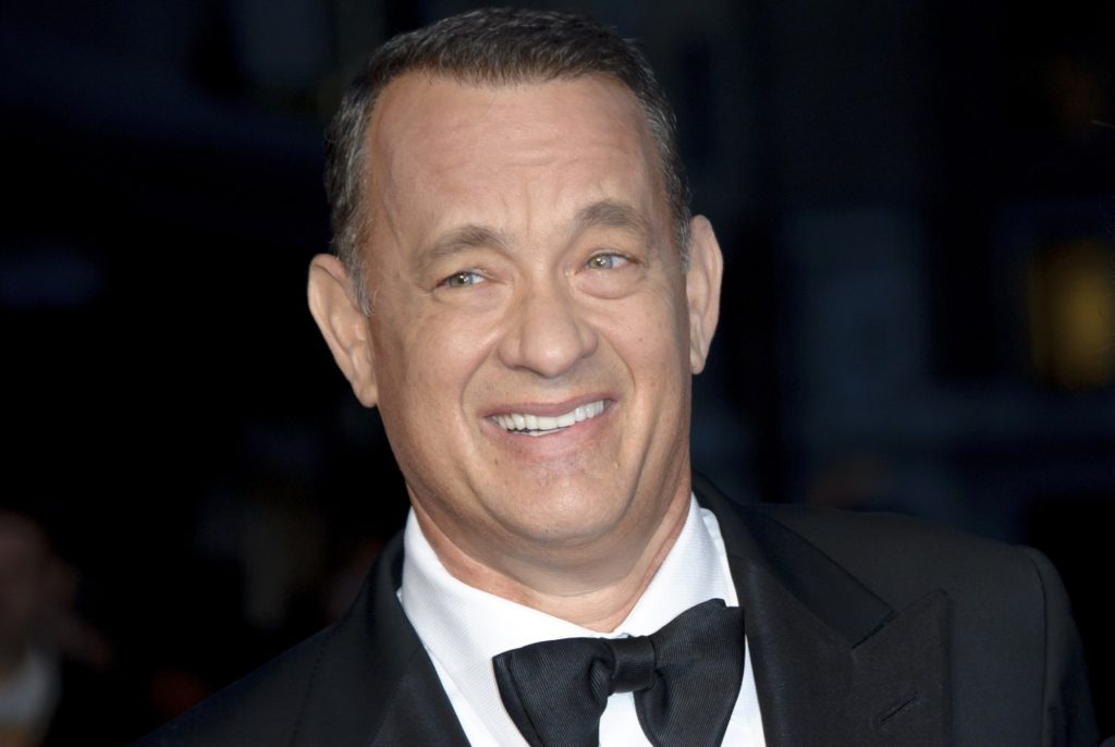 FILE - In this Oct. 9, 2013 file photo, U.S actors Tom Hanks and Rita Wilson arrive for the BFI London Film Festival European Premiere of "Captain Phillips," at a central London cinema. A Southern California insurance broker who overcharged Hanks and his wife, Wilson, hundreds of thousands of dollars has been sentenced to more than two years in federal prison. City News Service says Jerry Goldman received a 27-month sentence Monday, Nov. 4, 2013. (Photo by Jonathan Short/Invision/AP, File)
